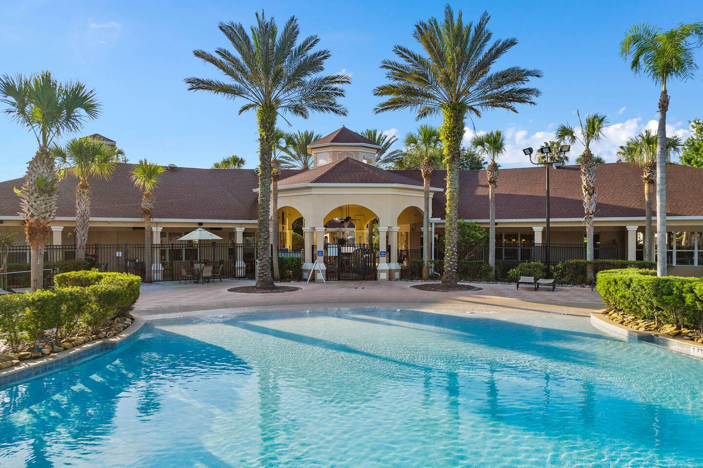 Resort Poolside Oasis: Luxury with palm trees and sun-kissed relaxation!