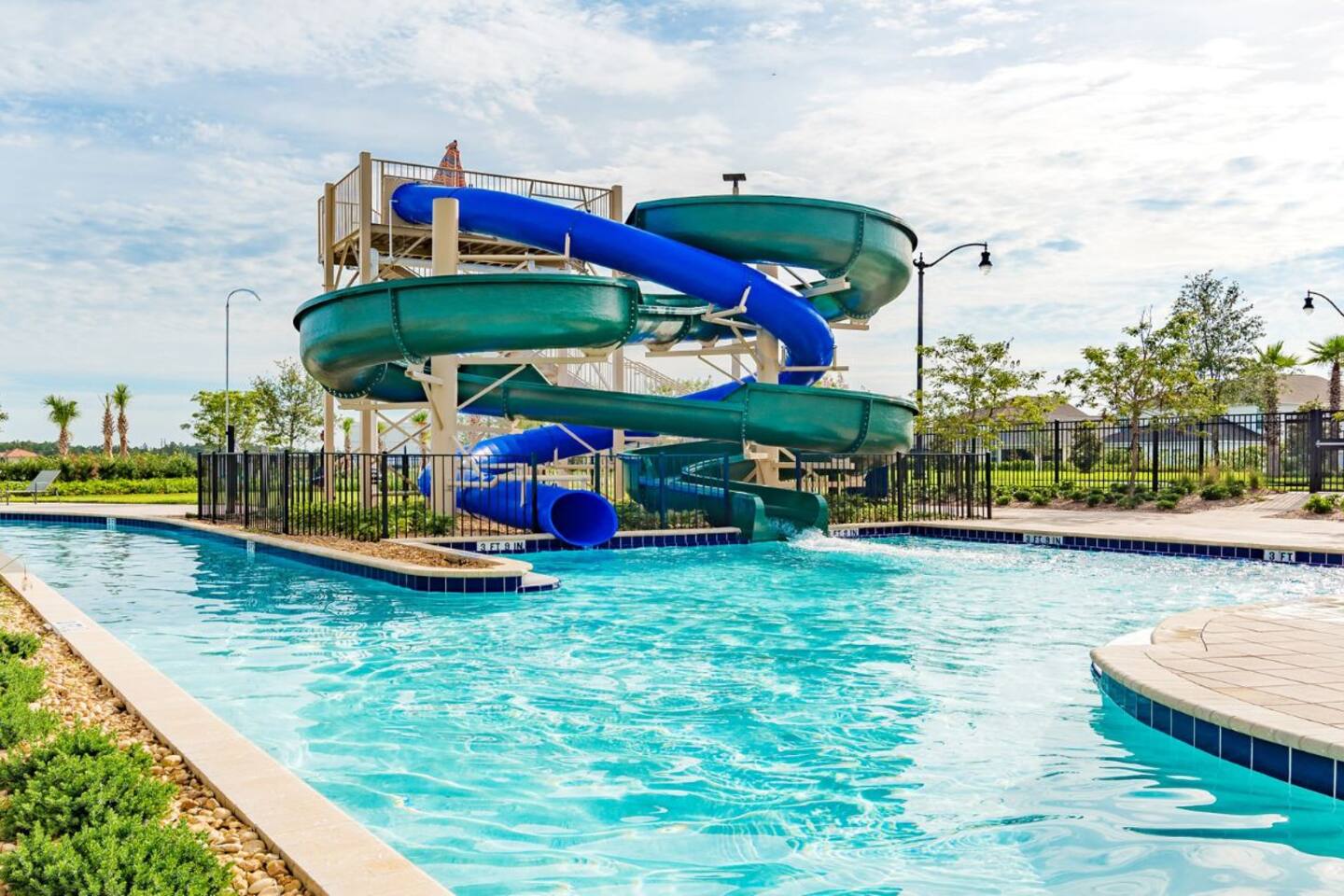 Resort waterslides winding down into the pool beside the lazy river